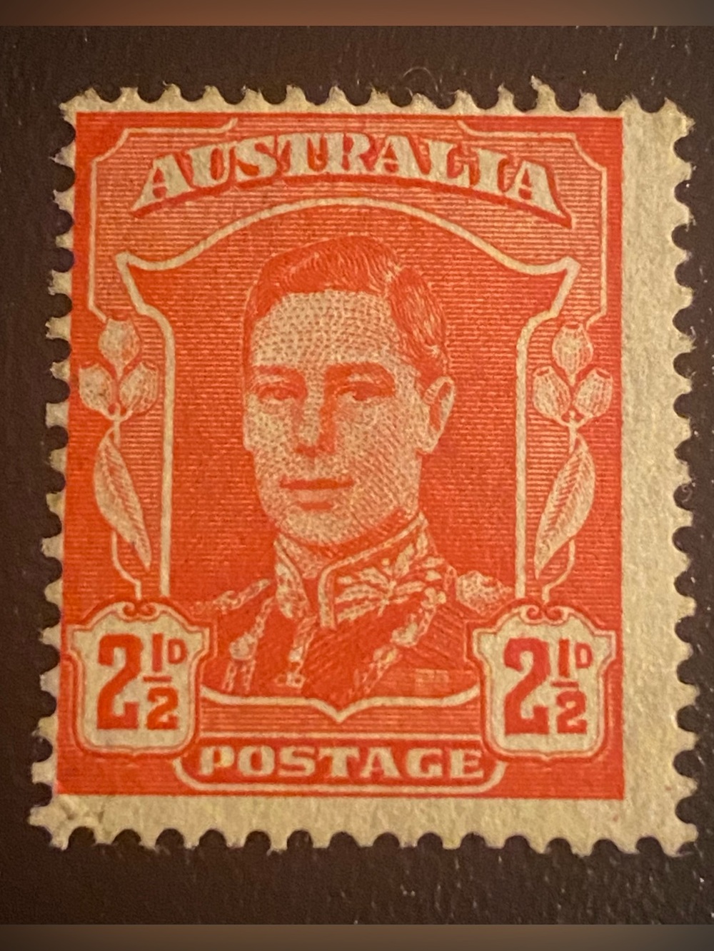 King George VI.It 2 1/2 pence (2 1/2d) orange-red postage stamp from Australia